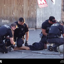 A police officer taking someone into custody.