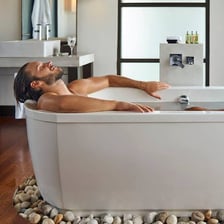 A person relaxing in a bathtub
