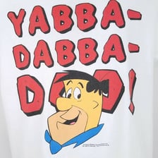 Fred Flintstone from The Flintstones associated with his famous catchphrase.