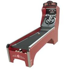 A Skee-Ball arcade machine with a sloped ball-rolling lane.