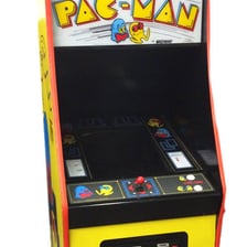 Arcade cabinet displaying the classic Pac-Man game