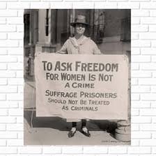 Women’s suffrage demonstrators holding signs demanding the vote.