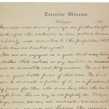 A historical document displaying the opening words of the Gettysburg Address.