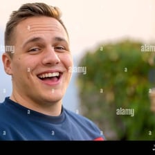 A cheerful person smiling and laughing.