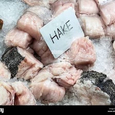 A hake fish displayed on ice.
