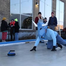 Curling teams competing in a bonspiel tournament