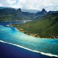 A small Polynesian coral islet surrounded by a tropical lagoon.