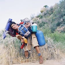An exhausted hiker strained by a demanding uphill climb