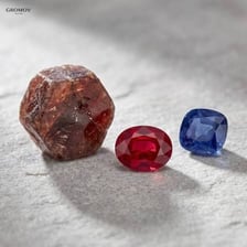 Corundum crystals shown alongside sapphire and ruby gemstones.