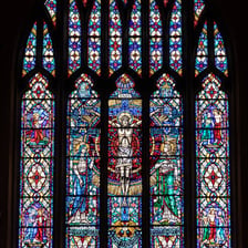 A cathedral window made of colored stained glass.