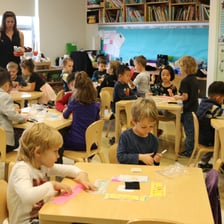 Young children sitting in a kindergarten classroom