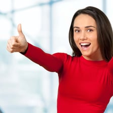 A cheerful, energetic person laughing and showing an animated personality.