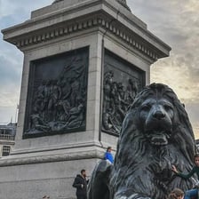 Trafalgar Square in London with its lion statues and Nelson’s Column
