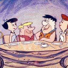 An illustration of the fictional town of Bedrock from The Flintstones.