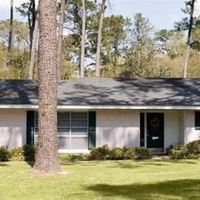 A low-profile ranch-style house with a single-story layout.