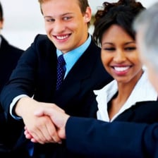 People having a friendly conversation and smiling.