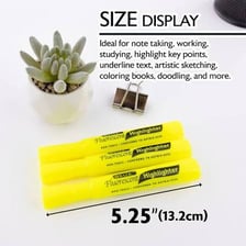 A fluorescent yellow highlighter marking a passage in a textbook