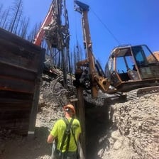 Temporary supports reinforcing a failing wall during construction