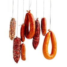 Sausage casing being used to form linked sausages.