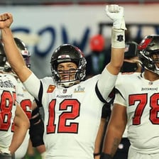 Tampa Bay Buccaneers players in team uniforms on a football field