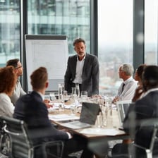 Business leaders meeting around a boardroom table