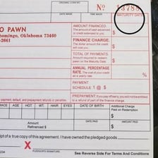A pawnbroker helping a customer redeem a pawn ticket at a shop counter.