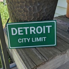 A roadside sign marking the limits of a city