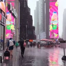 Heavy rain falling onto a city street.