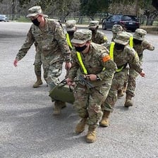 A military private in uniform during a training exercise.