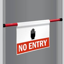 A barrier and no-entry sign representing restrictions.