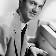 A portrait of Buddy Greco performing as a singer and pianist