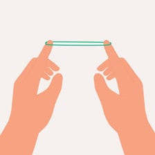 A stretched rubber band illustrating tensile behavior.