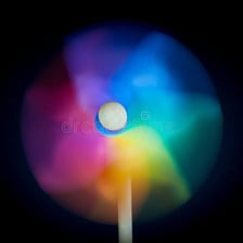 A pinwheel spinning rapidly in the wind.