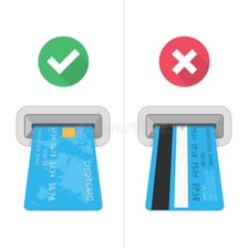 A bank card inserted into an automated teller machine.