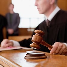 A courtroom scene representing the imposition of a legal penalty