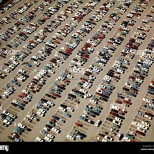 Cars parked in marked spaces in a parking lot
