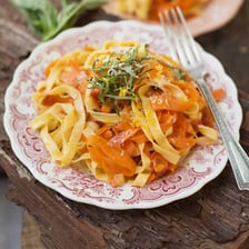 Long flat ribbons of fresh fettuccine pasta