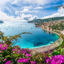 A Mediterranean Riviera coastline with upscale resorts and scenic waterfront.