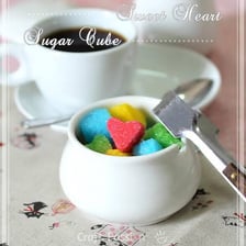 Sugar cubes beside a sweet dessert