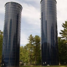 A tall vertical standpipe used for municipal water storage