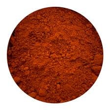 A sample of red ocher pigment in earthy powder form.