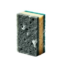 A porous sponge showing its soft, absorbent texture