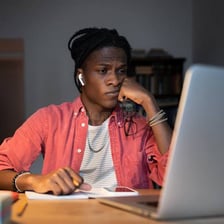 A person looking bored while doing a repetitive task