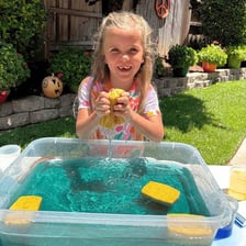 A sponge being soaked until it is full of water