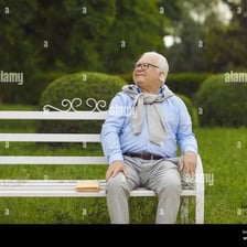 A person relaxing outdoors in a sunny park.