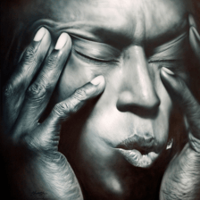An artist using an airbrush to apply paint