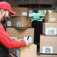 A parcel being handed to its recipient during delivery.