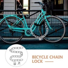 A bicycle fastened to a rack with a metal chain lock