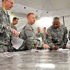 Soldiers planning or carrying out a military campaign