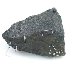 A natural lodestone, a dark mineral that attracts iron objects